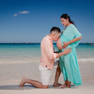 couple maternity photo session at the beach in tulum