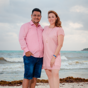 couple photo session with pink outfit on the beach playa del carmen