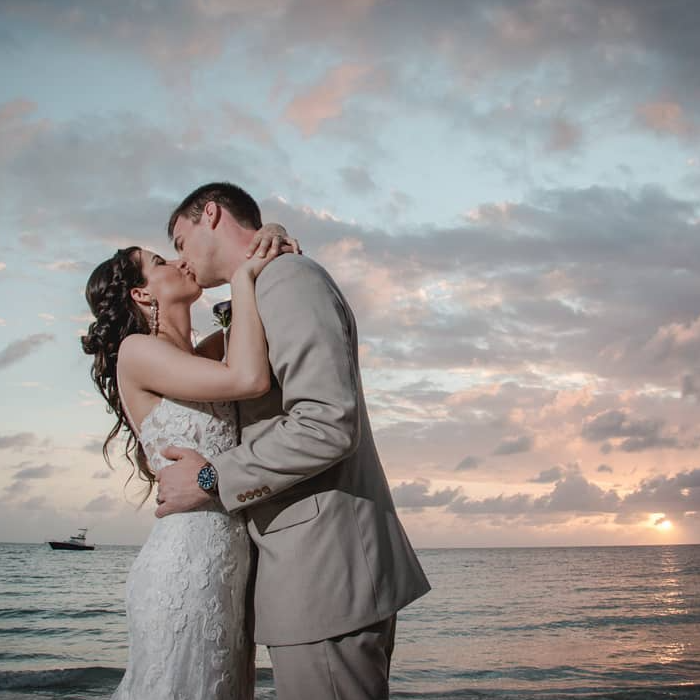 couple kissing just married in jamaica