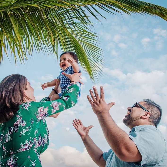 couple playing with their baby for a photo session